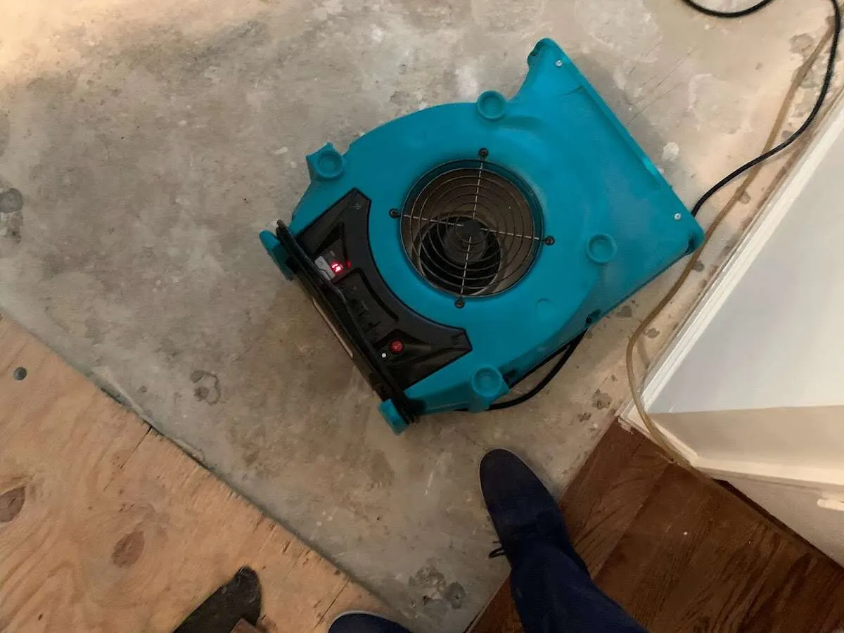 Air mover drying subfloor during Leak Detection & Repair in Steelton